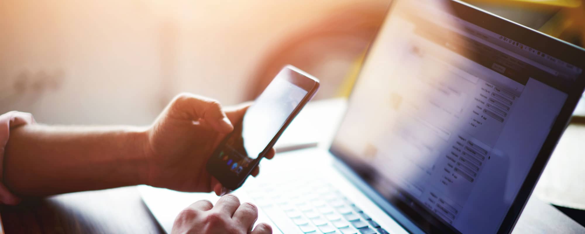 Tenant using laptop and mobile phone