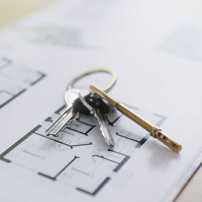 Keys laying on floor layout for new home